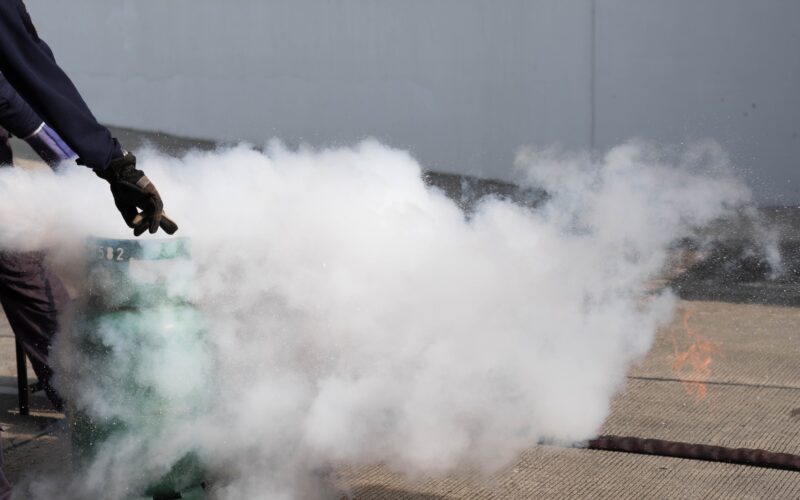 The instructor demonstrate and training the fire extinguisher use, fire evacuation training.